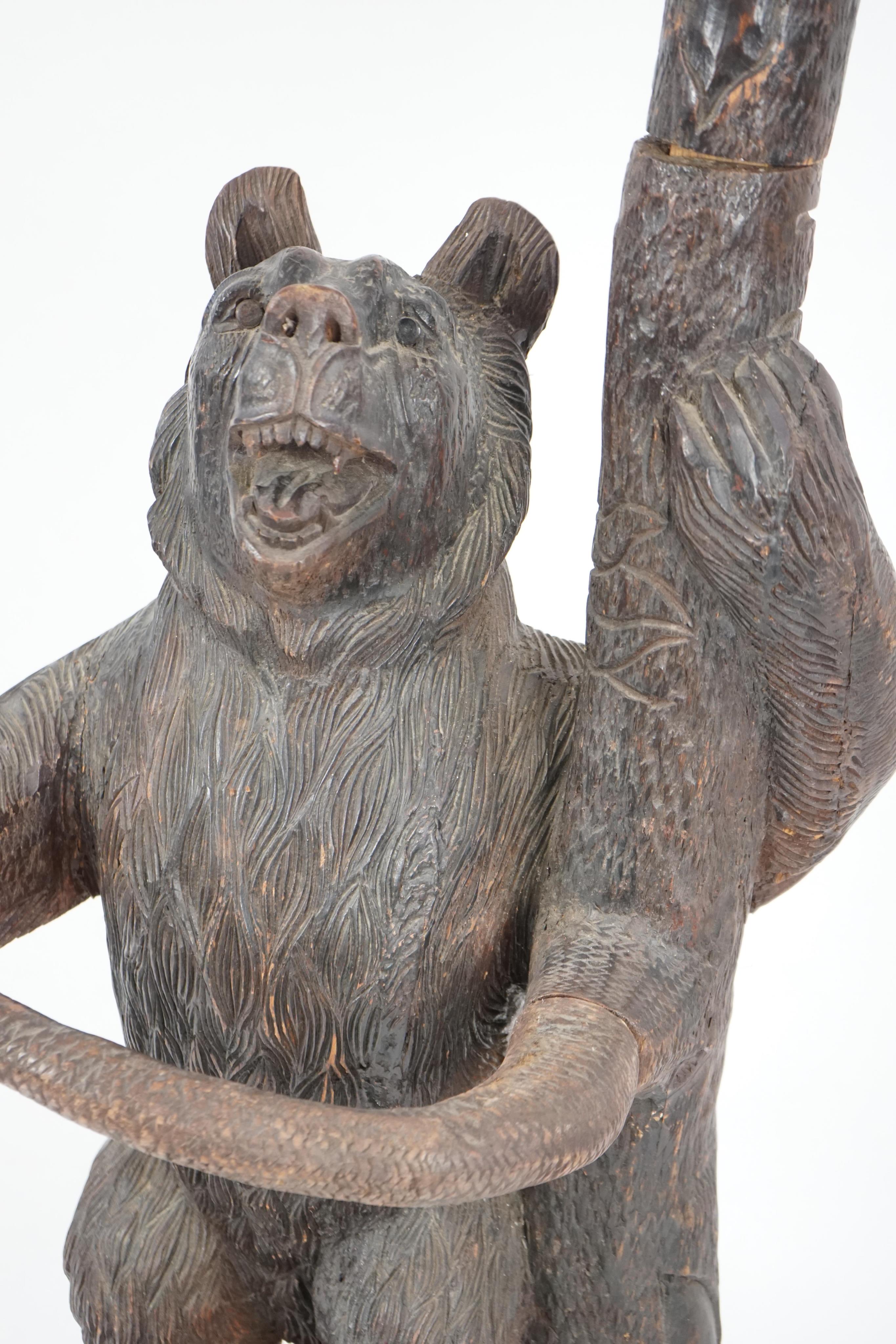 A late 19th/early 20th century Swiss ‘’Black Forest’’ carved wood hall stand
